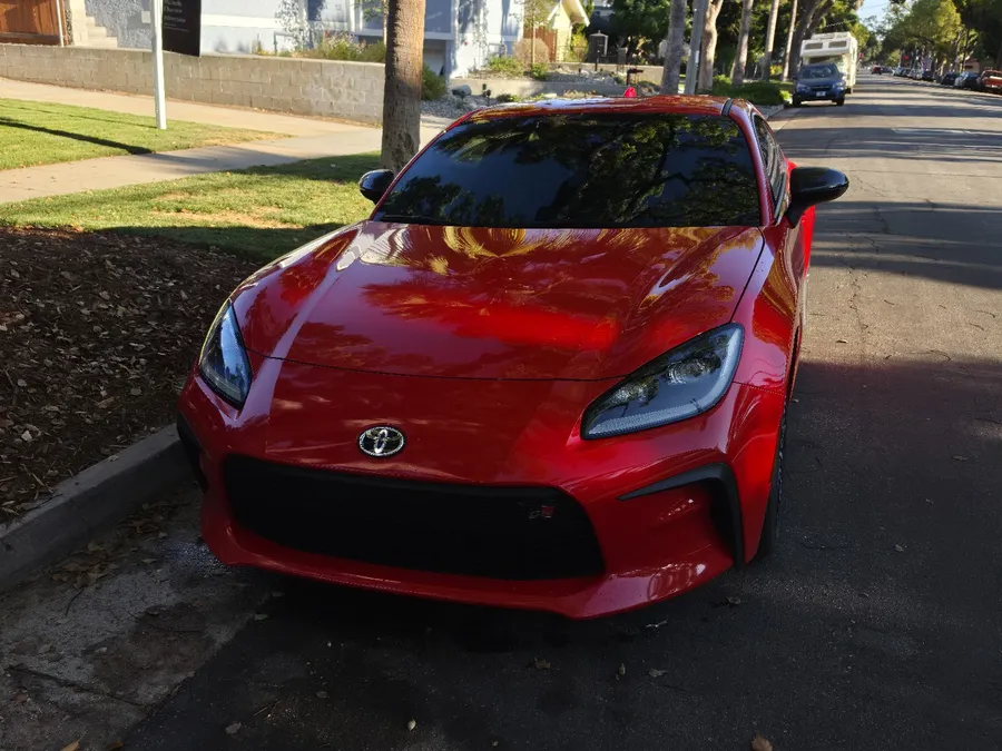Red Toyota GR86 with tinted front windows